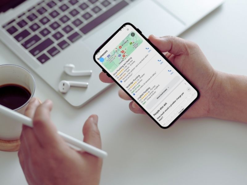 Image with phone showing Google Map Pack