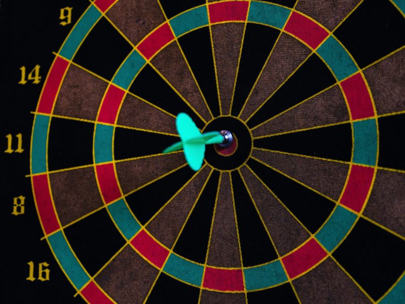 Dart in the bullseye of a dartboard