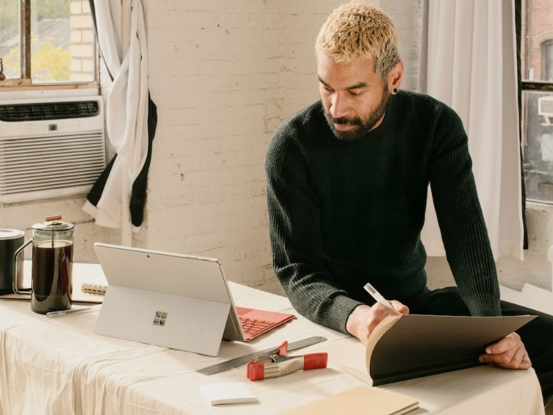 Small business owner working on a laptop at home