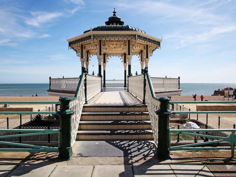 Ornate white bandstand on a seafront promenade