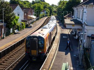Train arriving at a small station platform